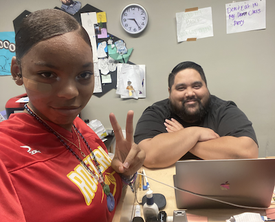 Photo of Daniel Avery, math teacher at IVA High in Long Beach with a student.