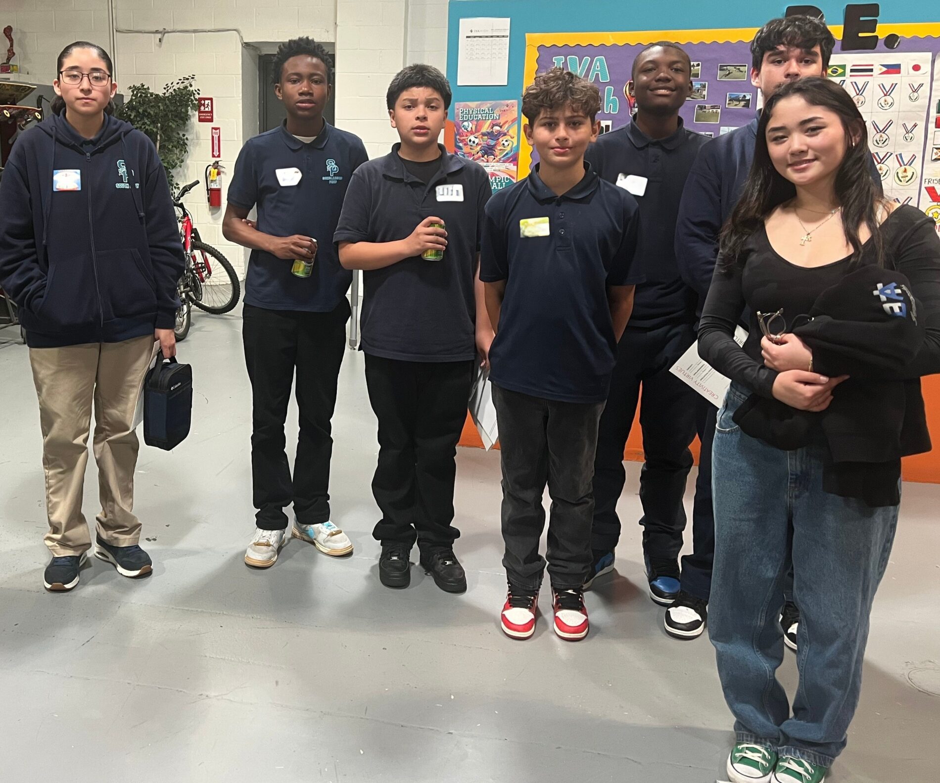 IVA Shadow Day One high school student and 5 middle school students stand together to start a tour.