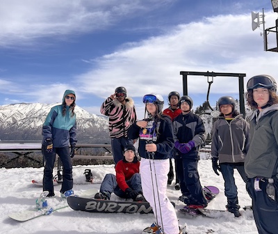 IVA High counselor Makenna Briceno snowboarding with students in Big Bear as part of the Outdoor Adventure Club.