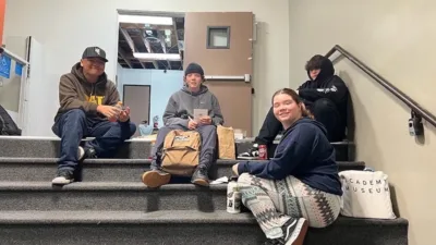 Students sitting on stairs together.