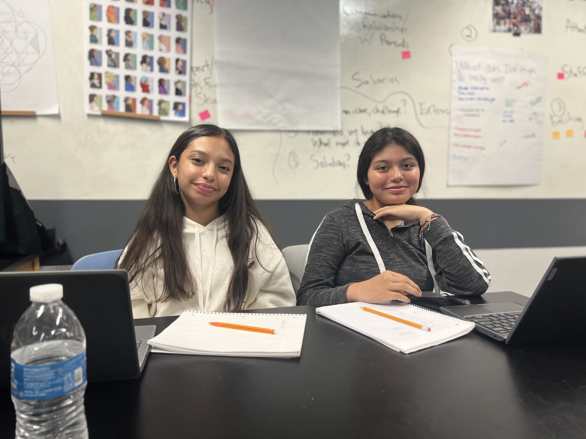 two smiling students in a classroom at IVA High in Long Beach