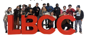 Students at IVA High stand in front of a large sign that says LBCC for Long Beach City College