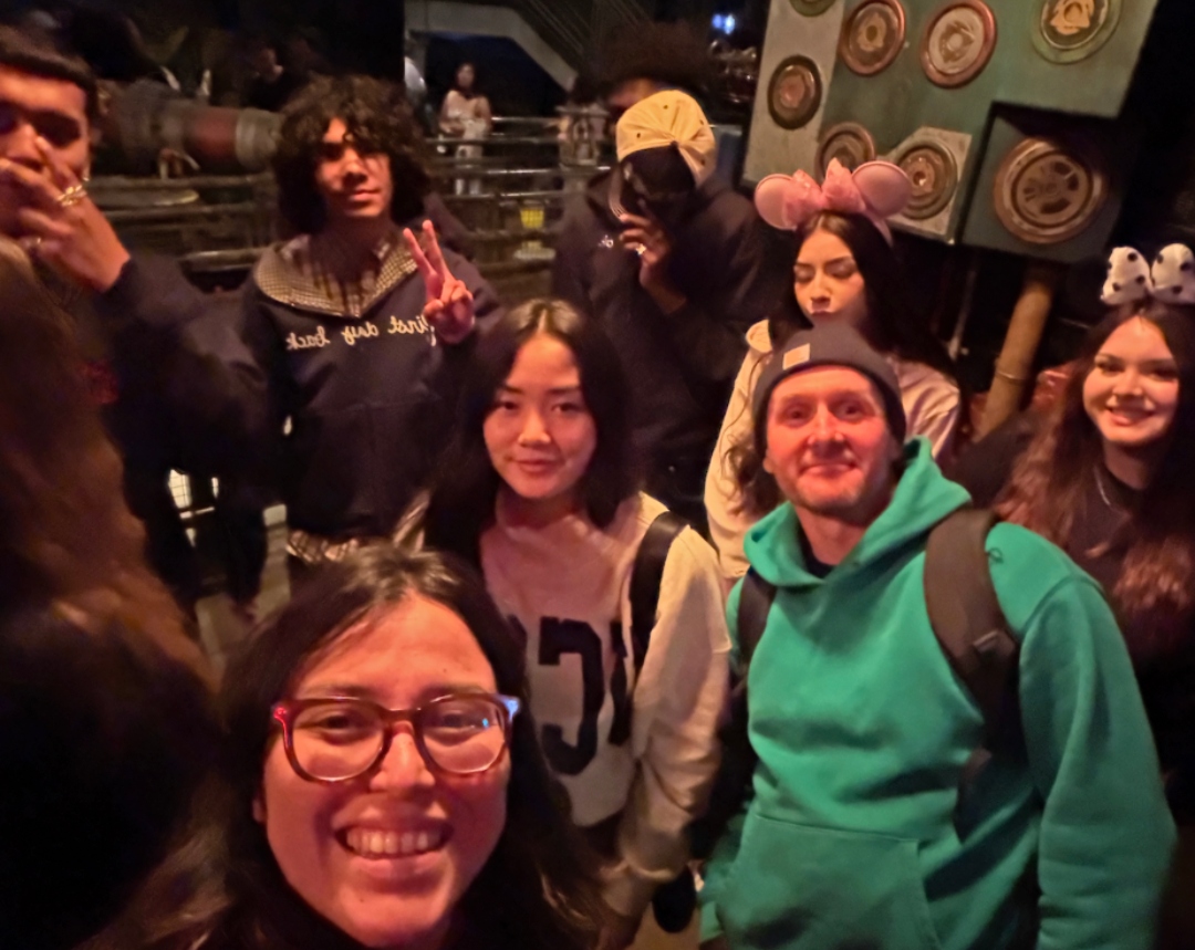 students and staff from IVA High gather for a photo during senior grad night at California Adventure Disneyland